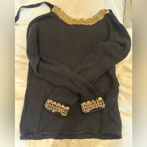 Black Maje sweater with gold hardware on the neckline & cuffs.